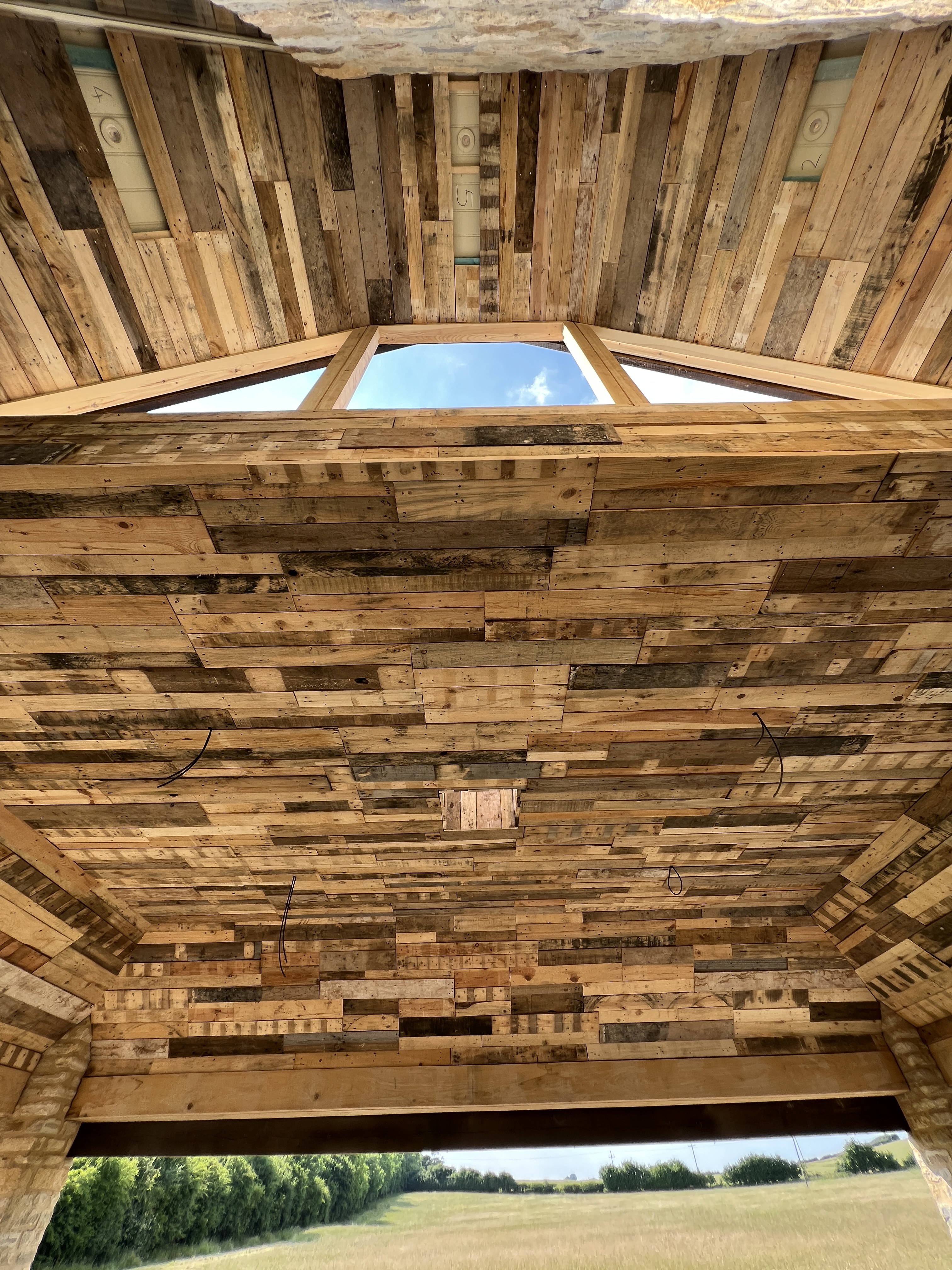 Reclaimed pallet timber ceiling with skylight in bespoke garden room